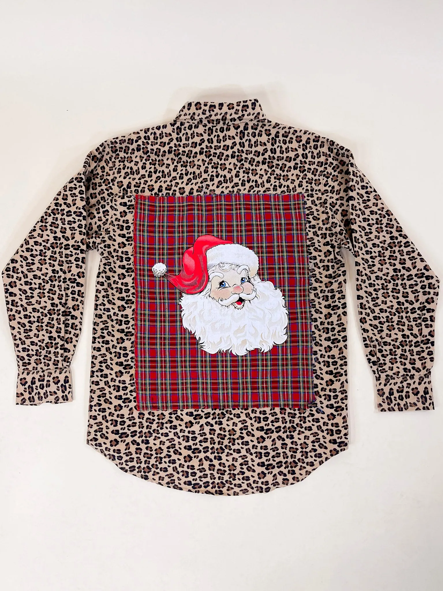 Prettiest In Prints Button Up Leopard Print Flannel Top with Red Plaid and Santa Icon